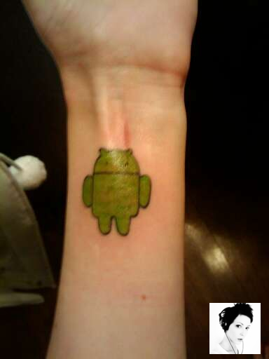  with her new green Android tattoo on the underside of her left forearm.