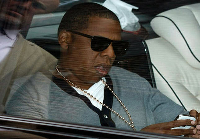 Jay Z using a smartphone