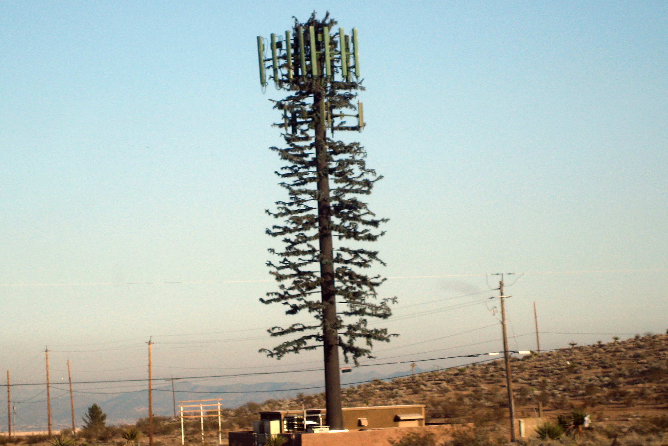 A cell phone tower image with a lot of antenna