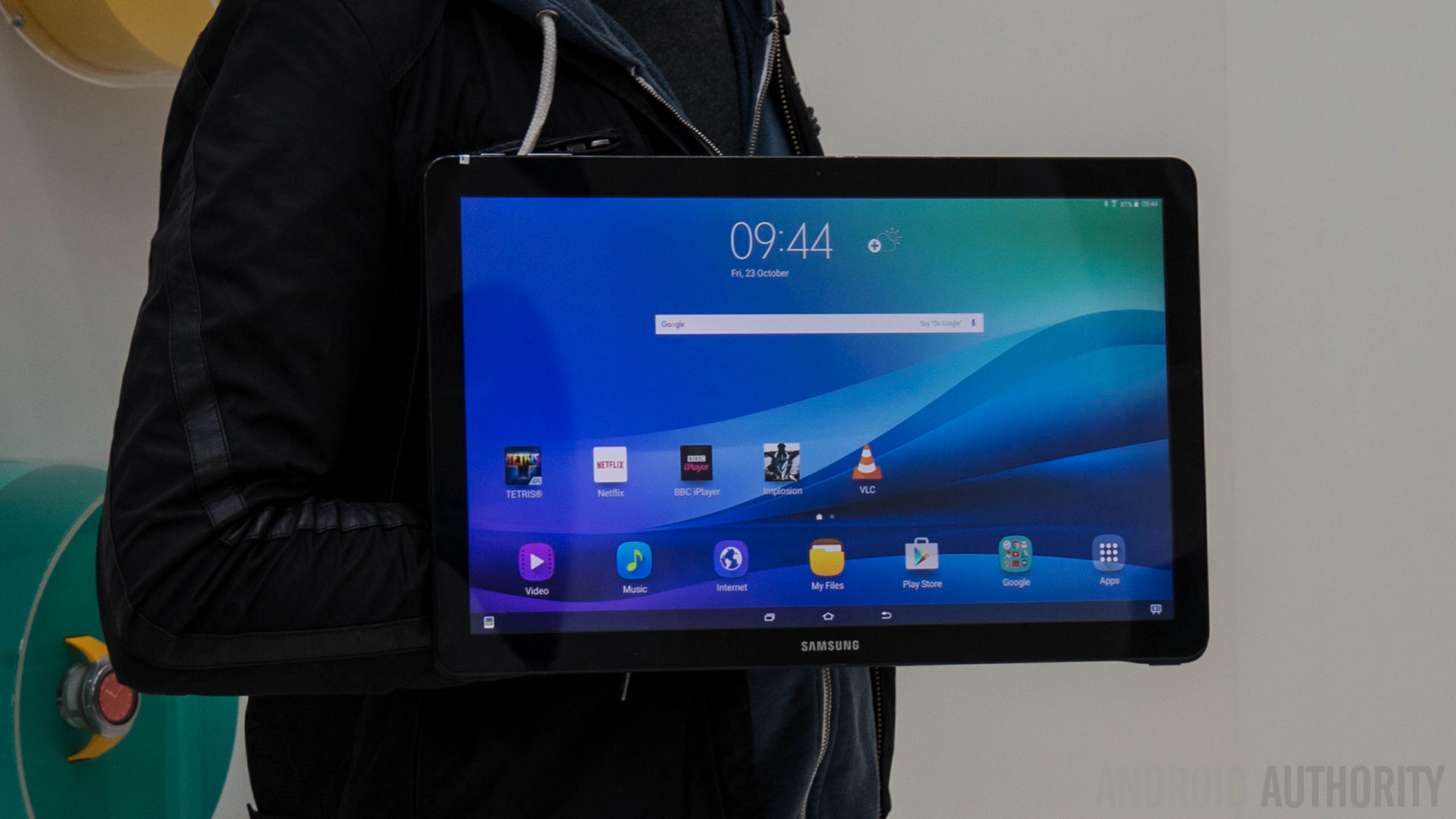 The Samsung Galaxy View facing forwards with a person behind it. 