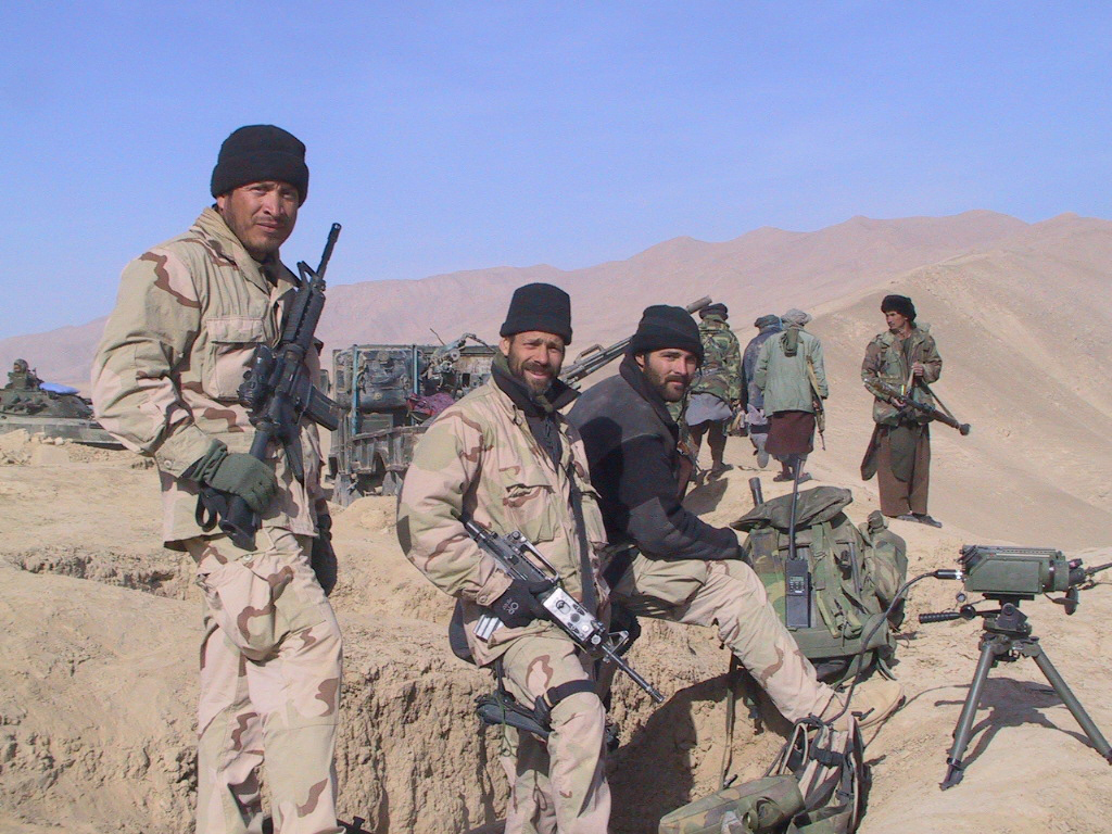 Vigil (left) with members of his team and members of the Northern Alliance west of Konduz Afghanistan in late 2001.