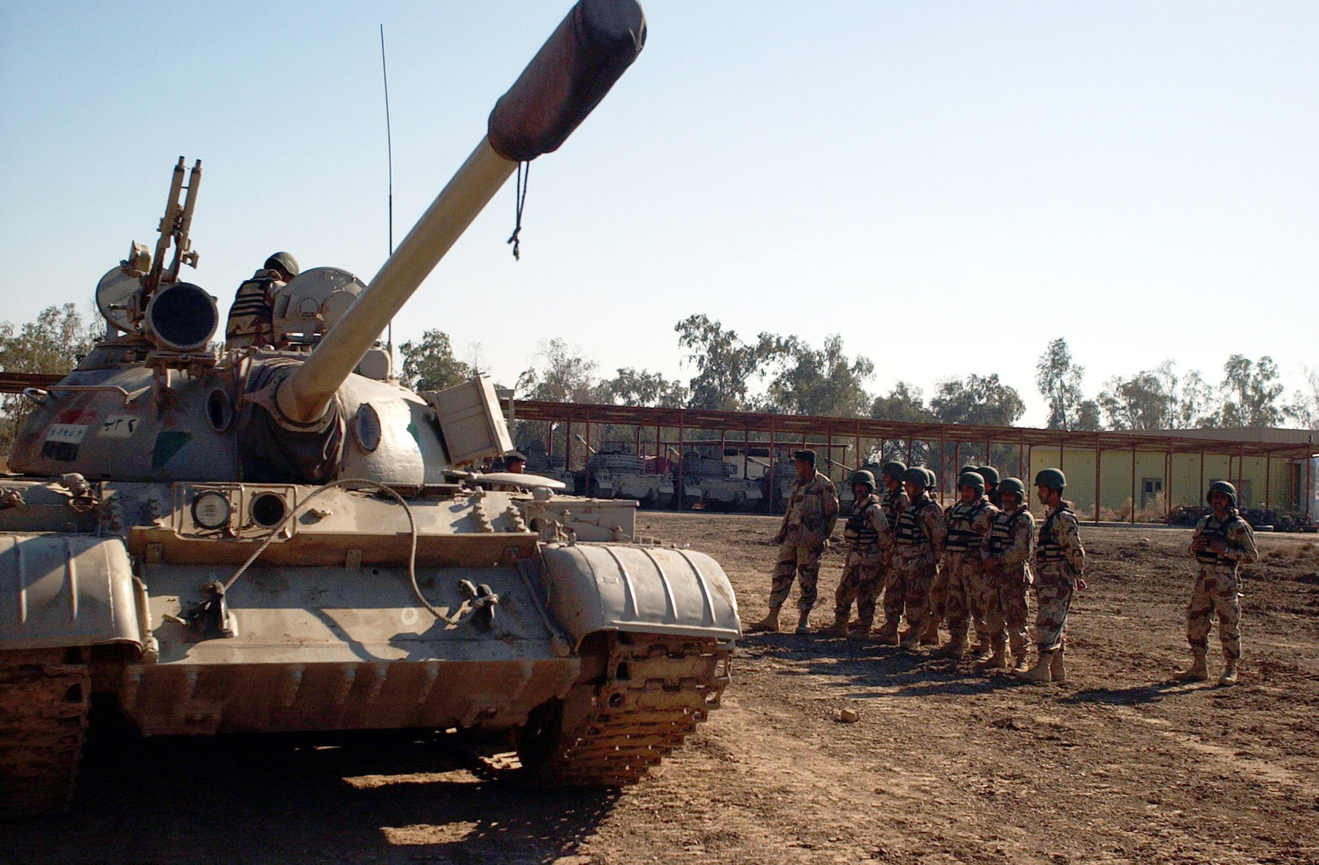 Iraqi Soldiers from the 3rd Battalion, 3rd Brigade, 9th Iraqi Army Division, many of whom are recent basic training graduates, practice crew evacuation and roll over drills during the tank driving portion of a round robin exercise at Camp Taji, Iraq on January 24, 2007. (U.S. Army photo by Sergeant Jeffrey Alexander) (Released)