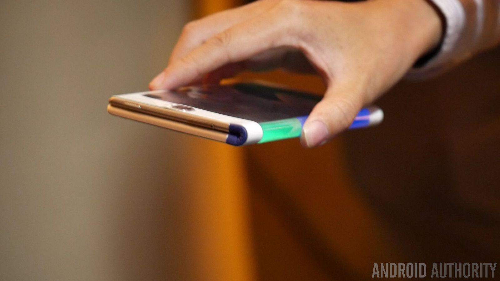 A folding smartphone concept from Lenovo in a person's hand.