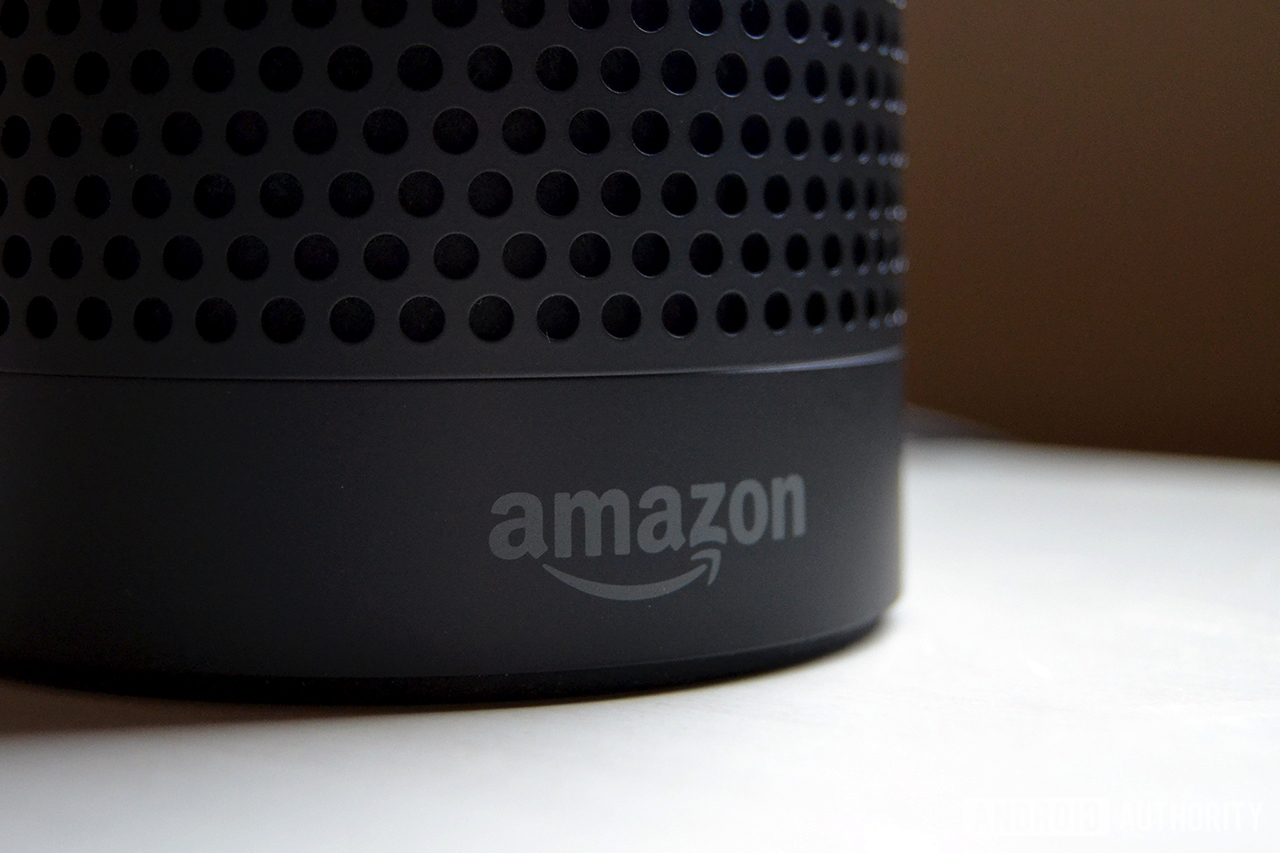 Amazon Echo with Amazon logo showing. The image is to show the difference between the Echo and Amazon Echo Plus.