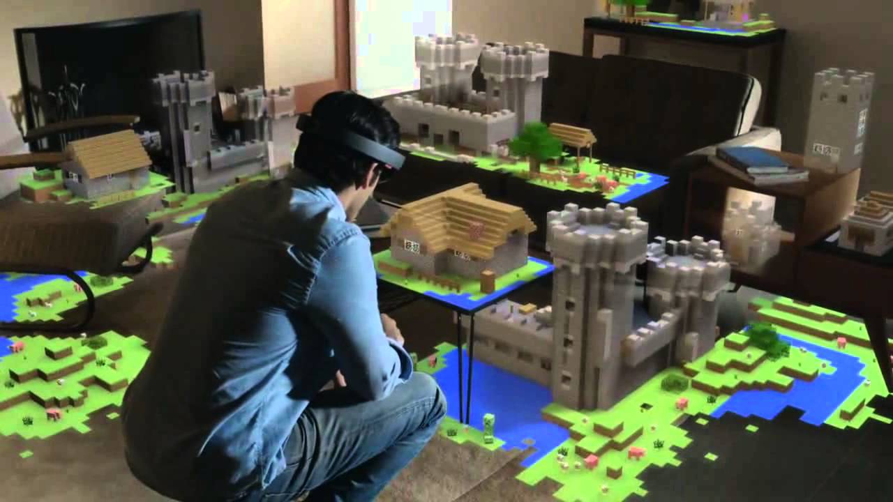 Photo of a man wearing Microsoft Hololens and playing minecraft in augmented reality