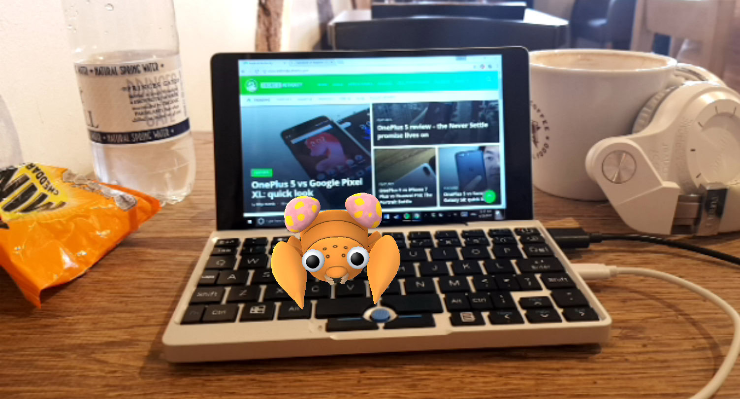 Photo of an augmenter reality pokemon go character resitng on a notebook.