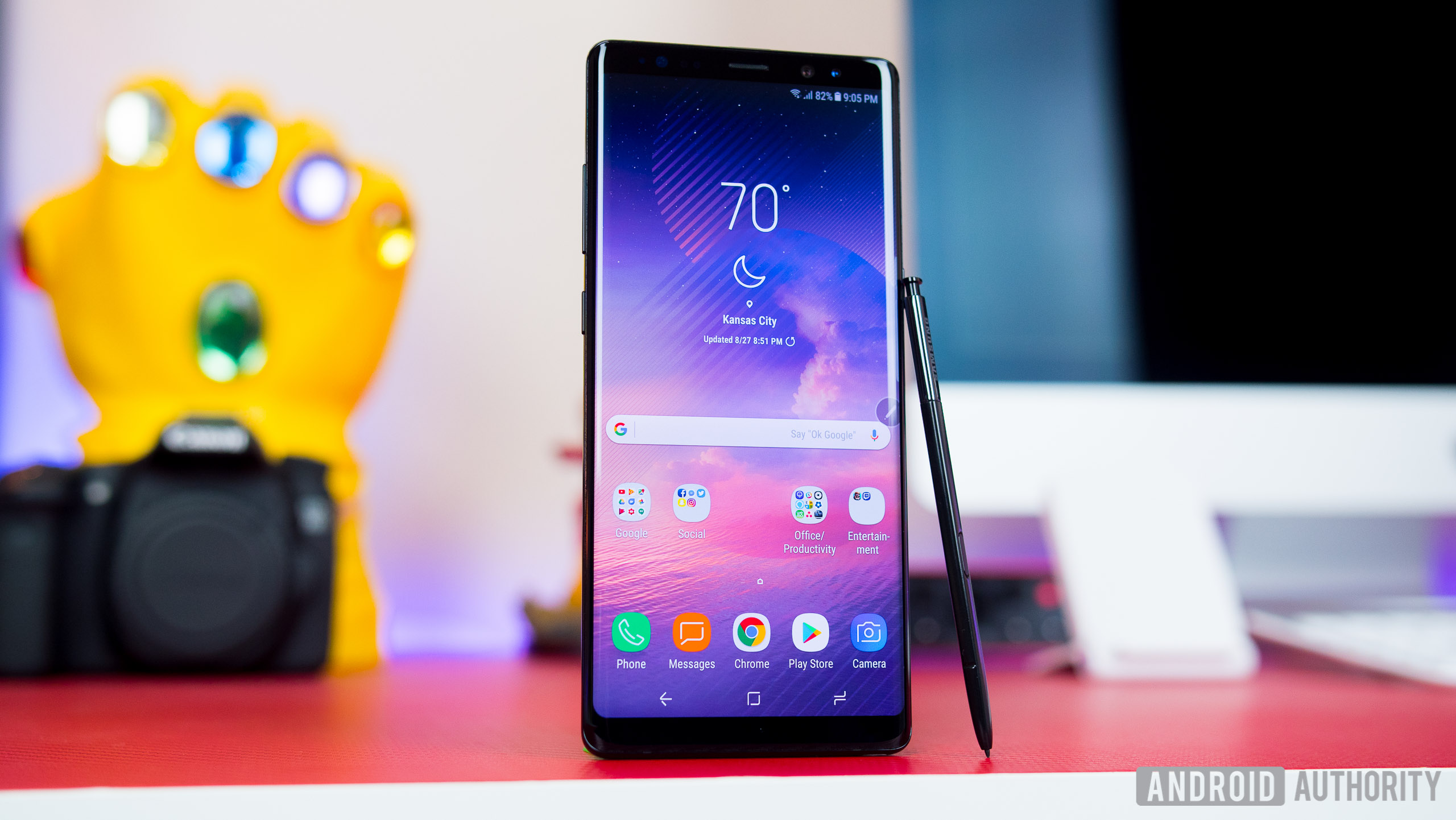 The Samsung Galaxy Note 8 standing on a table with its S Pen stylus leaning against it.
