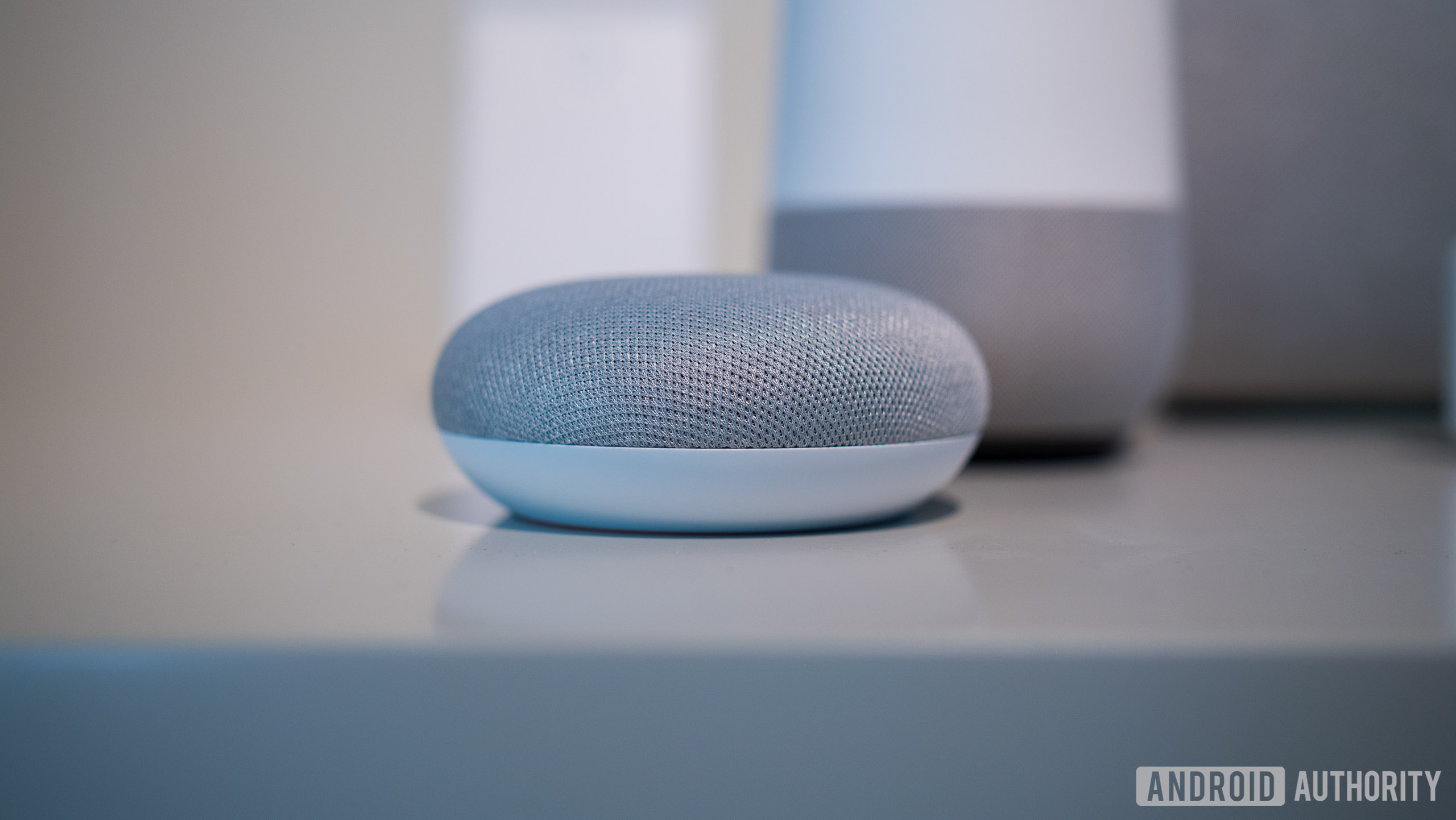 Google Home Mini on a table - free smart speaker with Spotify Family promo