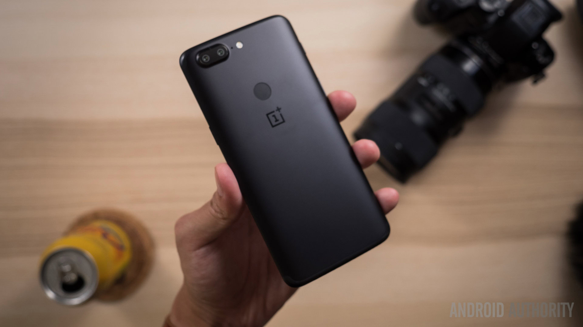 OnePlus 5T held in hand showing back of phone.