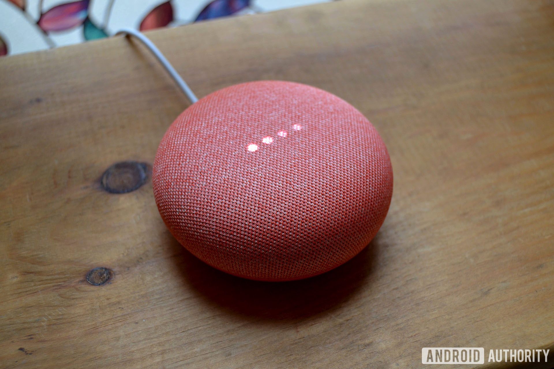 Pictured is the Google Home Mini in the coral color.