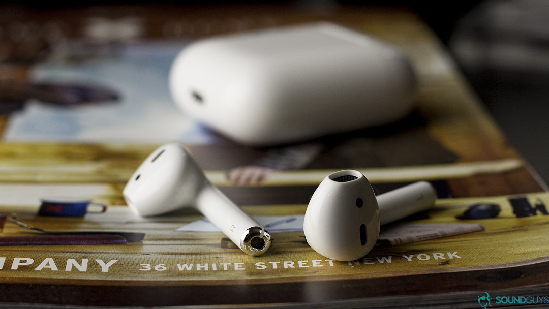 The Apple AirPods 1st generation on a magazine.