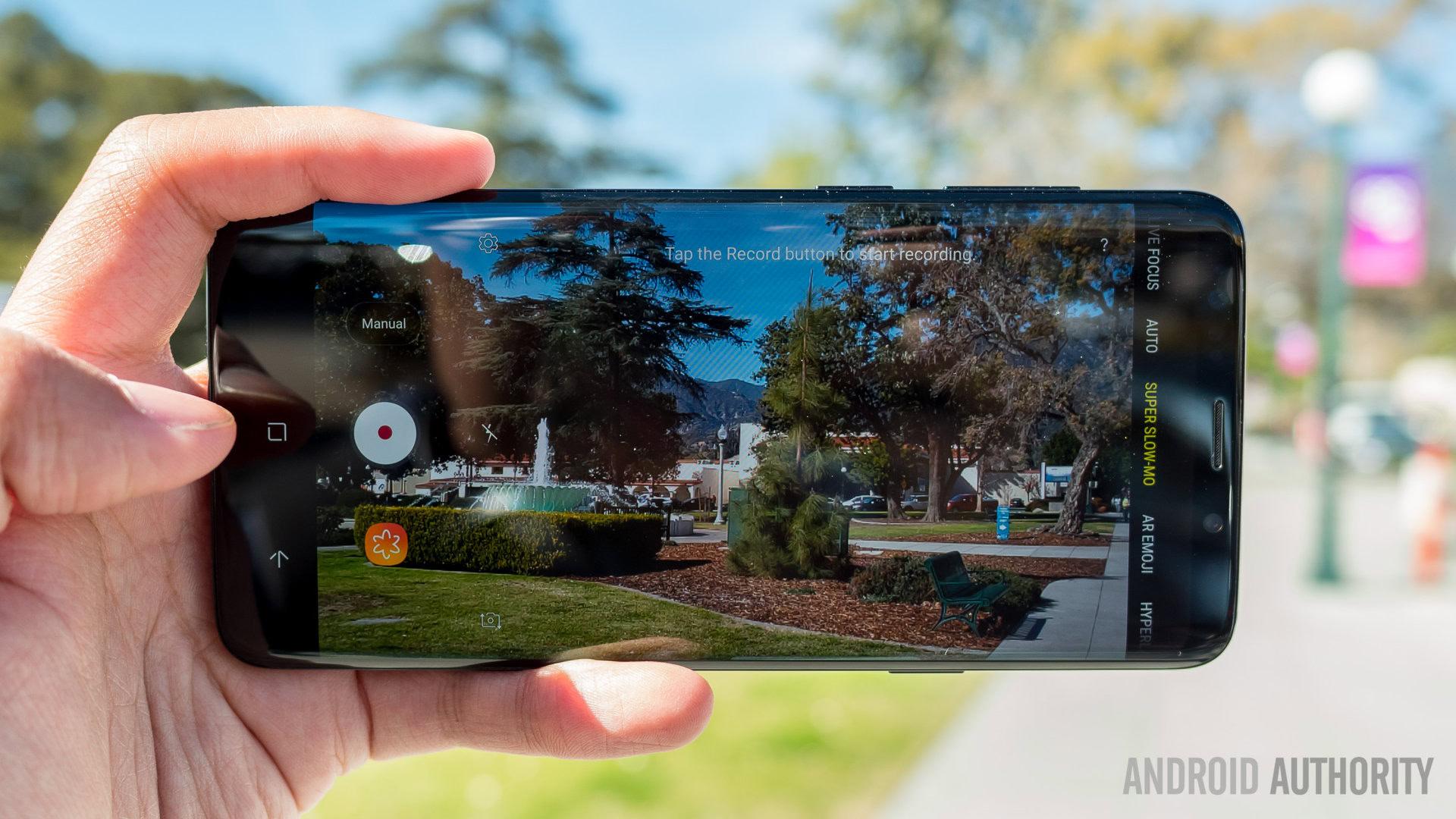 A photo of the Samsung Galaxy S9 shooting video in bright daylight.