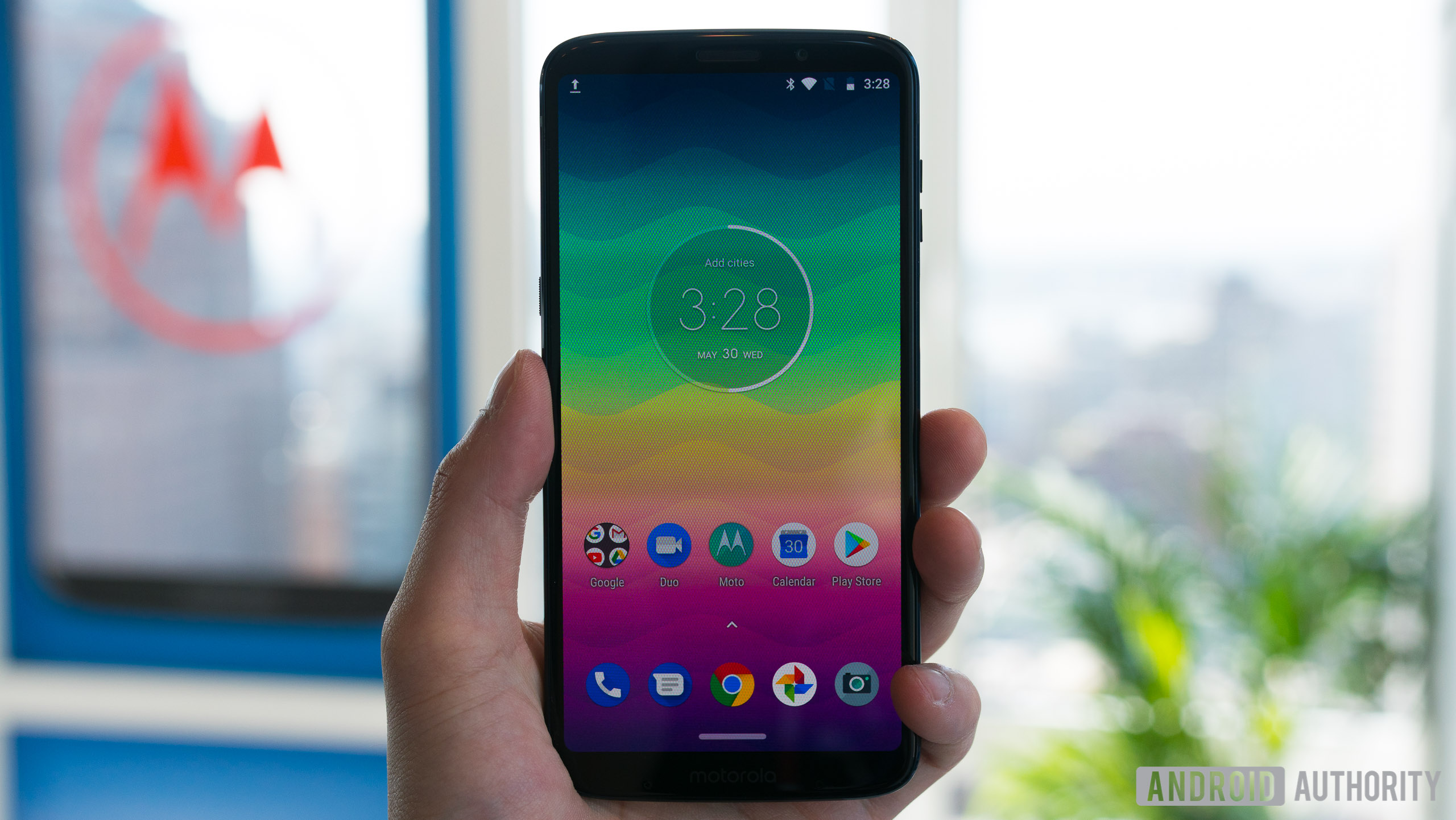 frontal shot of moto z3 play showing the homescreen and navigation interface
