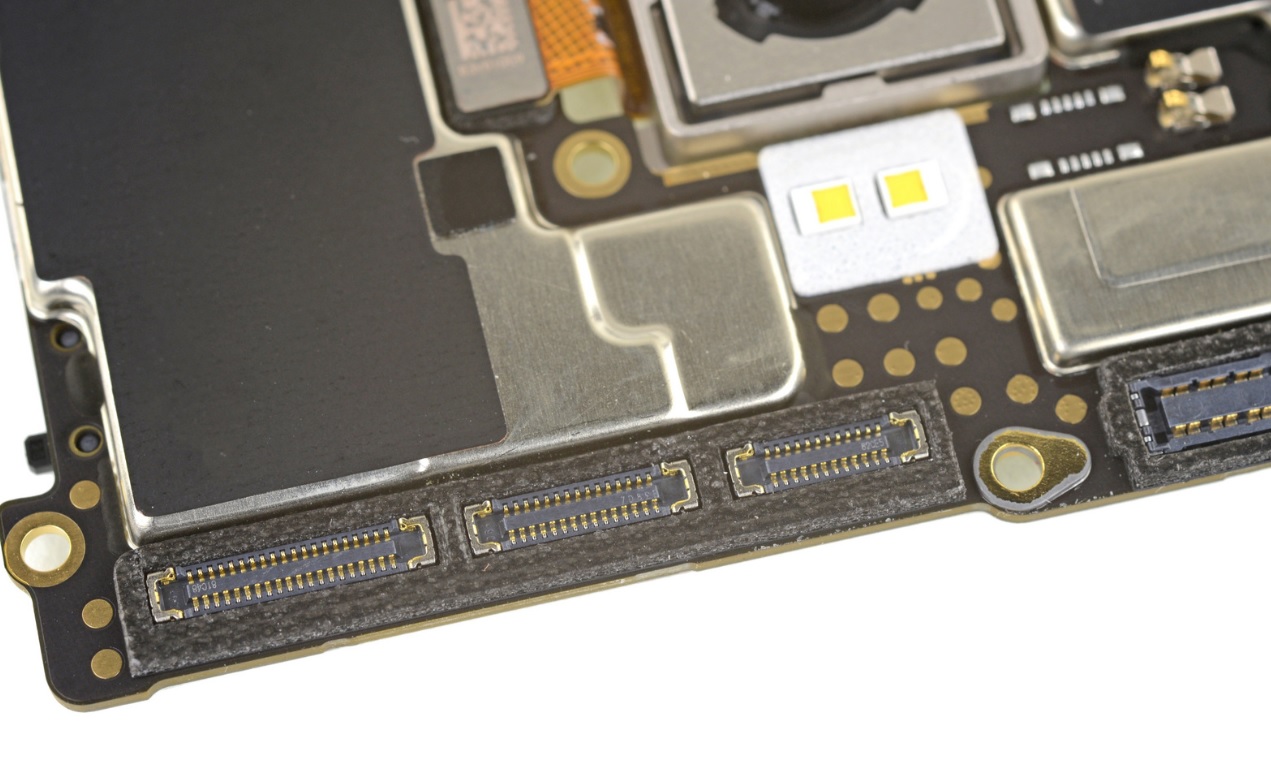 A closeup of the motherboard sockets seen during a OnePlus 6 teardown.