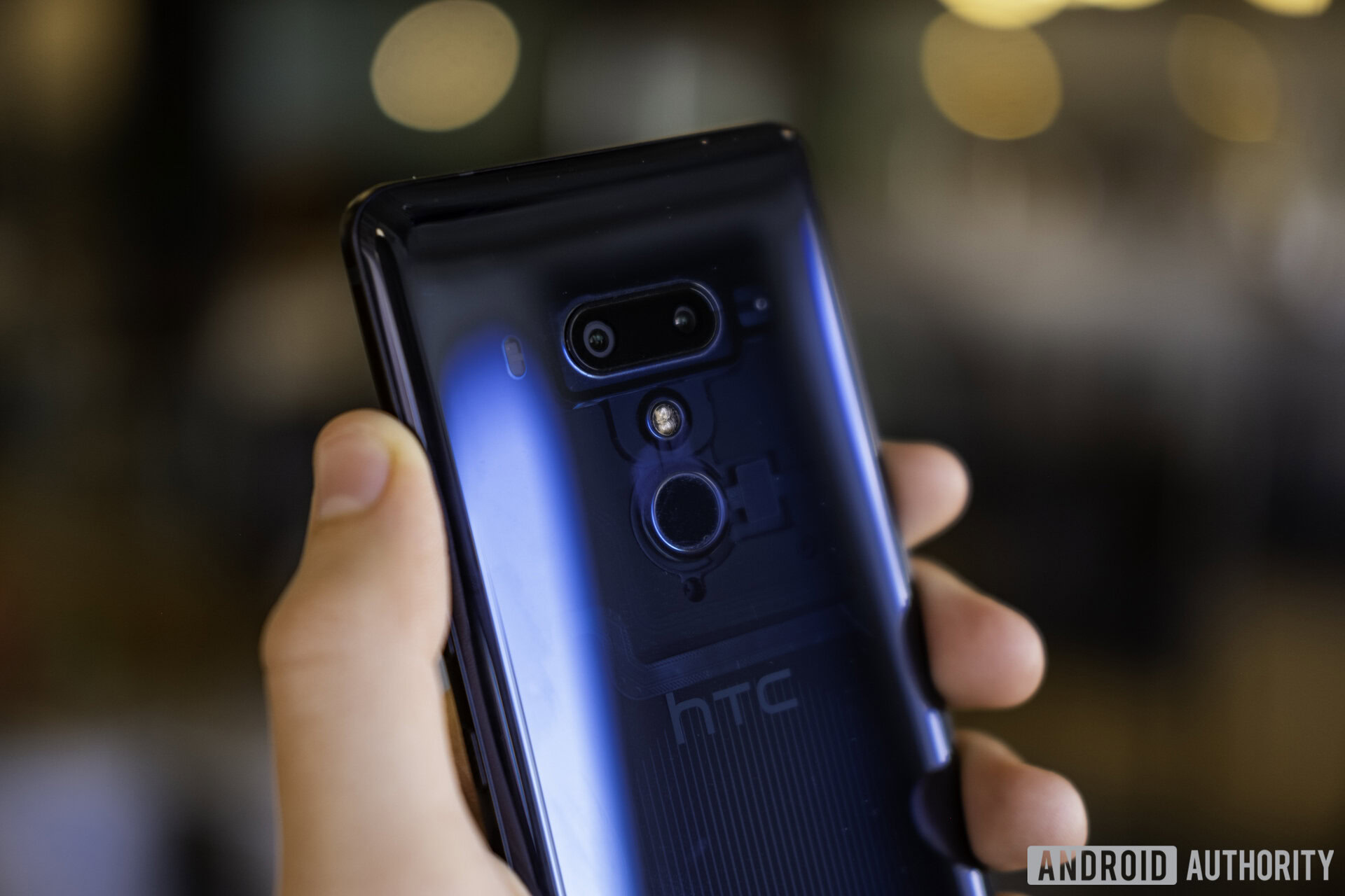 HTC U12 Plus in a person's hand.