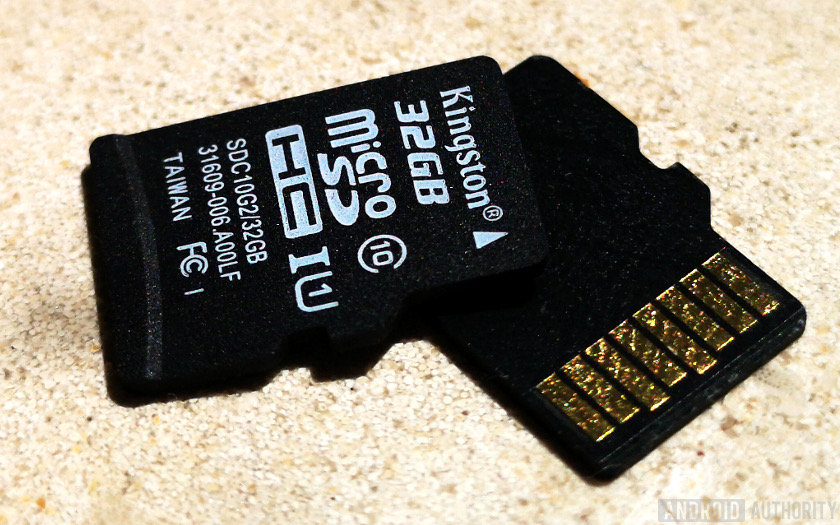 A Kingston 32MB microSD card on top of another microSD card.