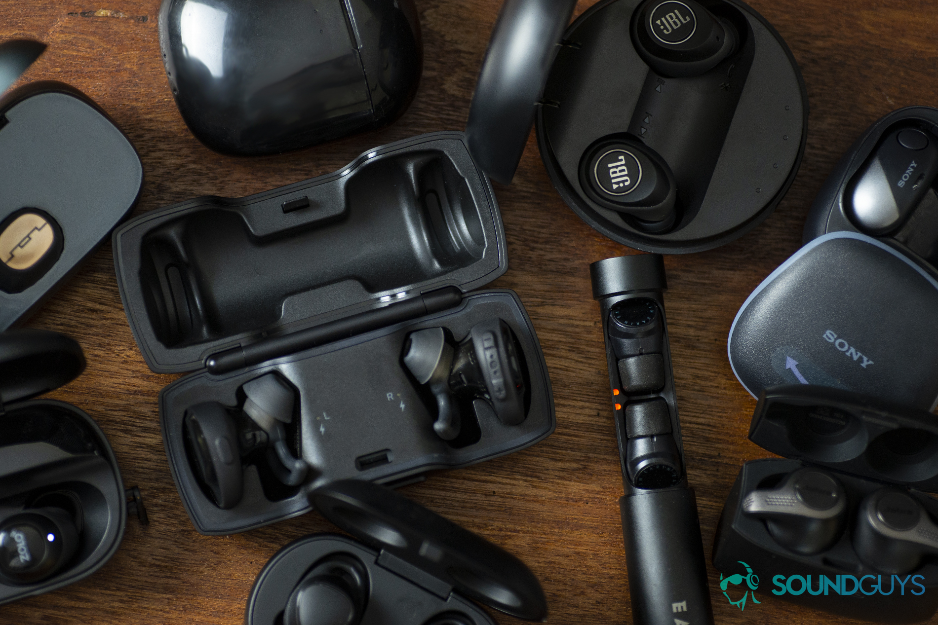Top 3 excuses for ditching the heapdhone jack: A photo of several true wireless earbuds, including the Anker Zolo Liberty, Bose SoundSport Free, Earin M-2, Jabra Elite 65t, JBL Free, Optoma Nuforce BE Free8, Samsung Gear IconX, Sol Republic Amps Air, and the Sony WF-SP700N.