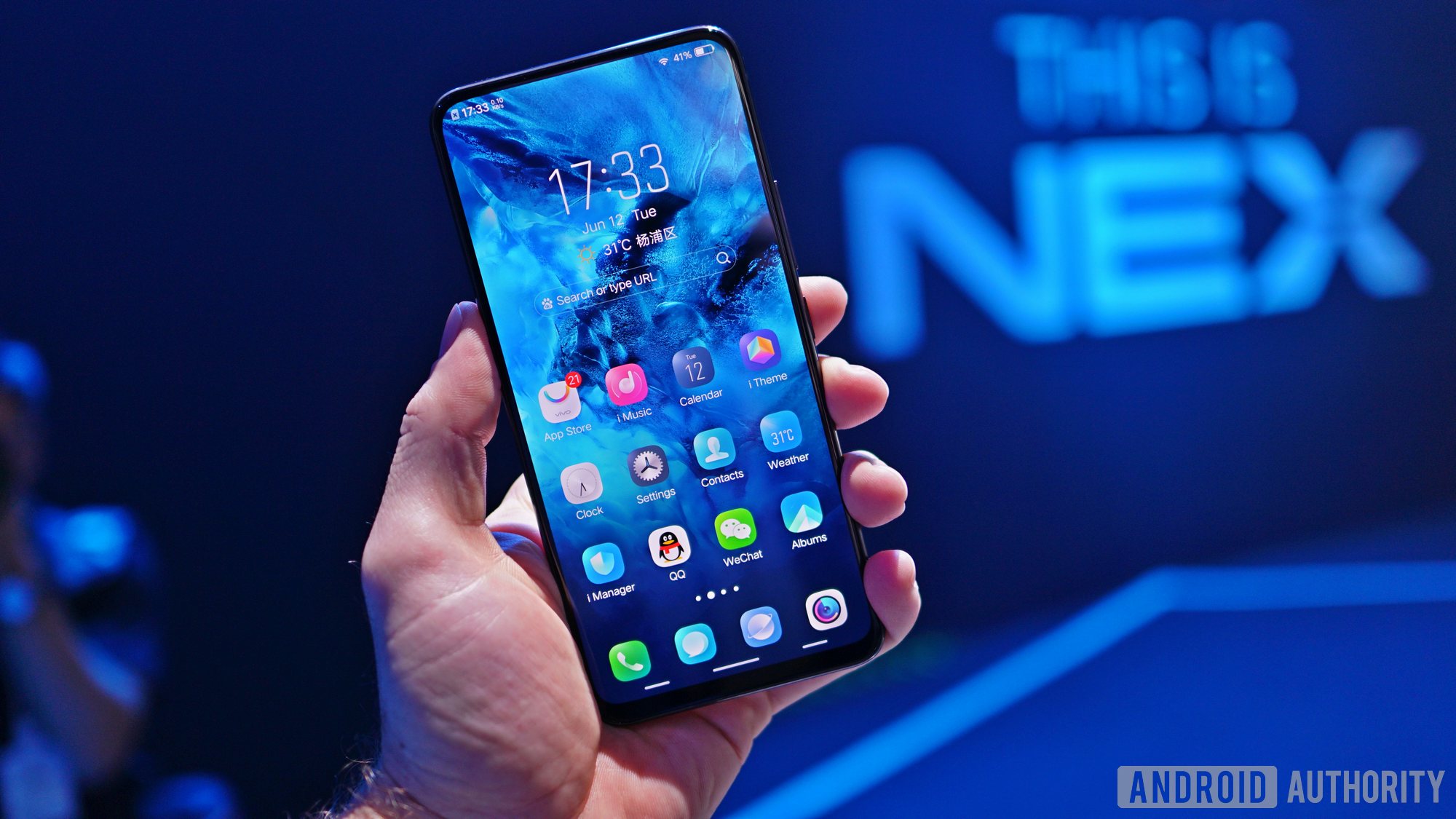 The Vivo Nex with a blue background at a launch event. 