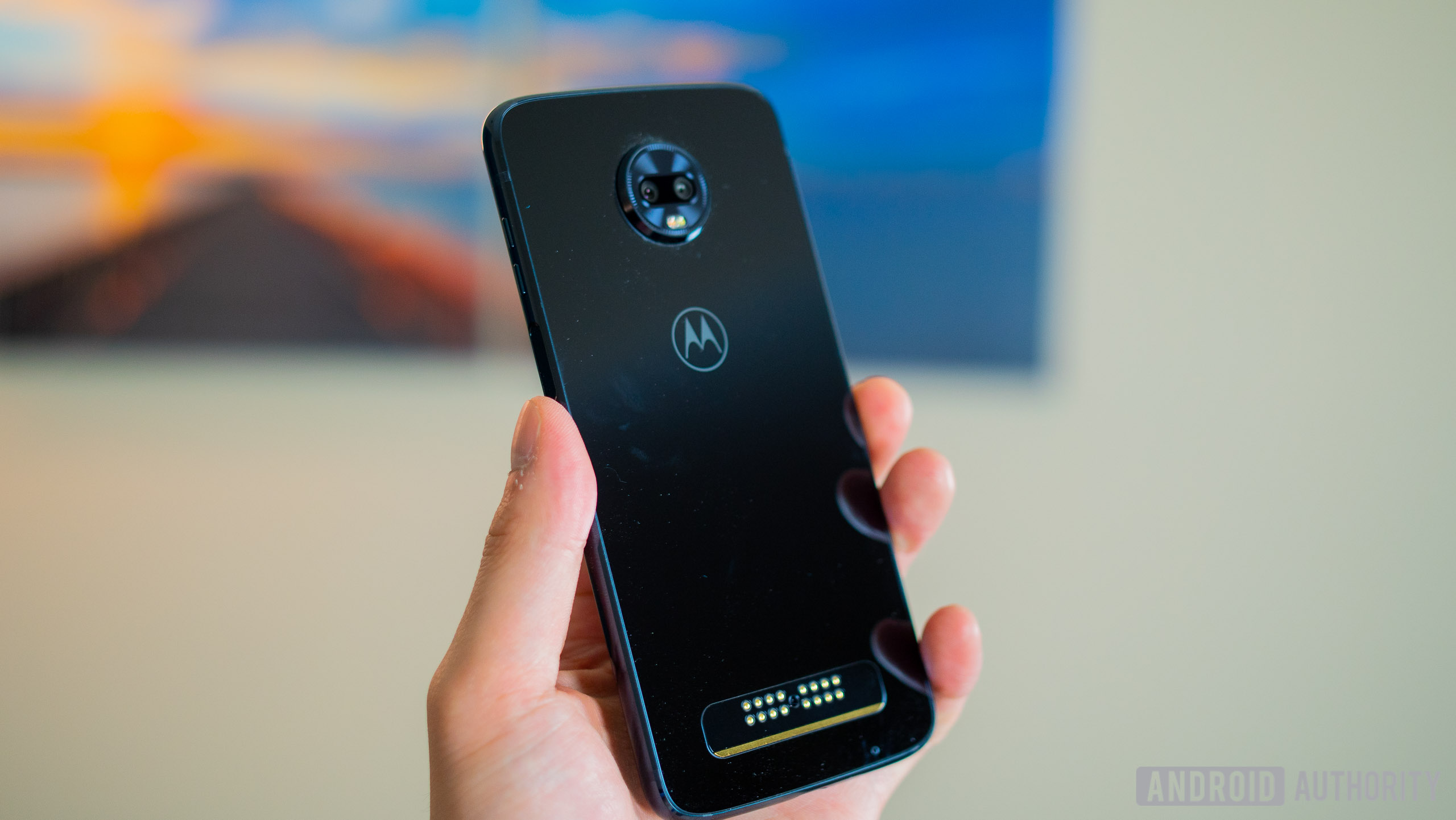 moto z3 play held in hand two back cameras