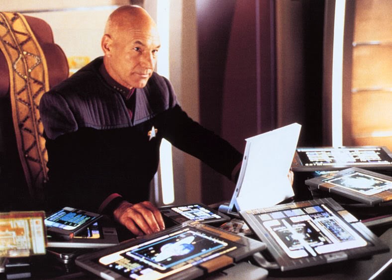 Captain Picard with PADD in Star Trek