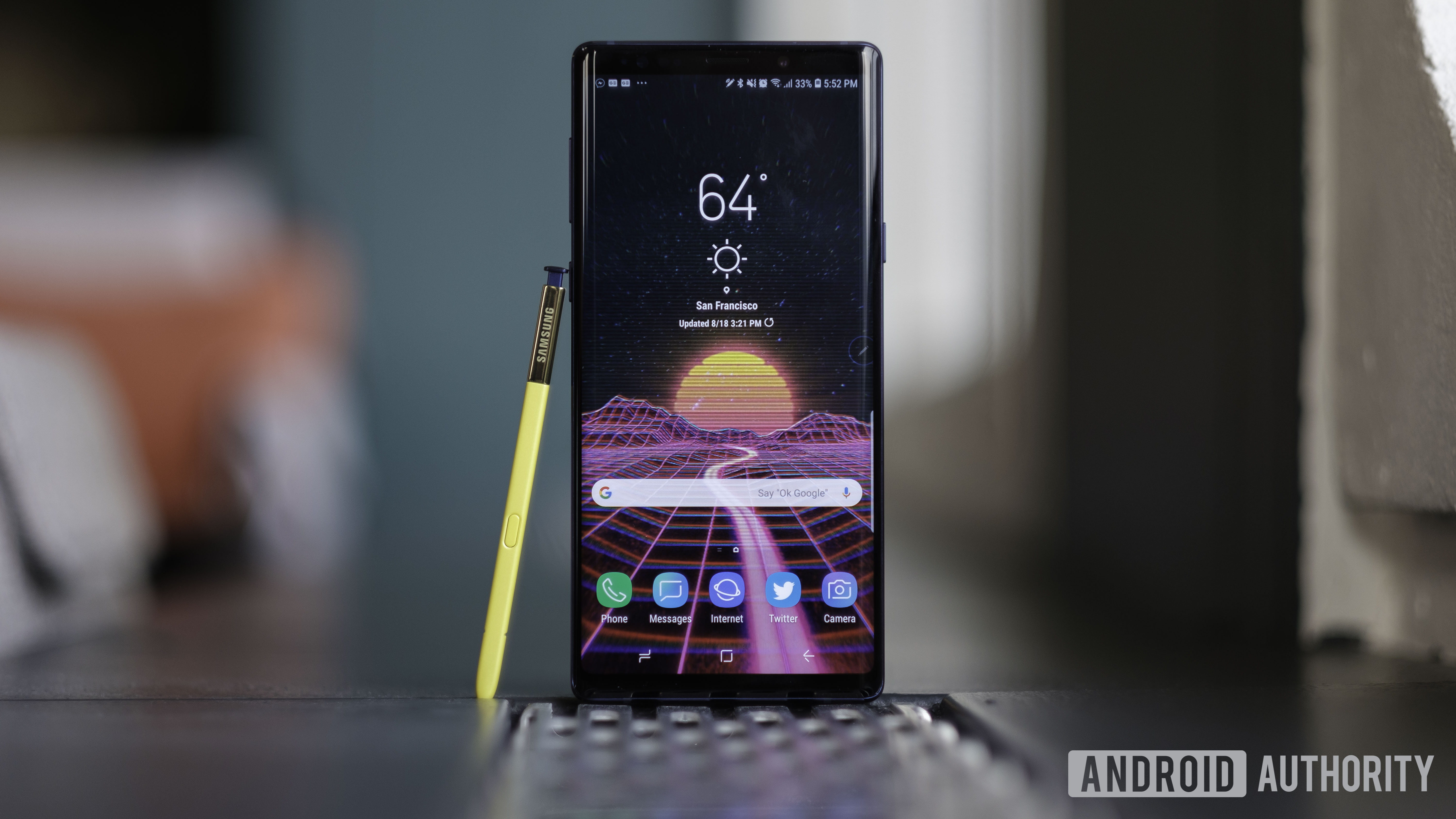 A photo of the Samsung Galaxy Note 9 upright, with S-Pen leaning against it.