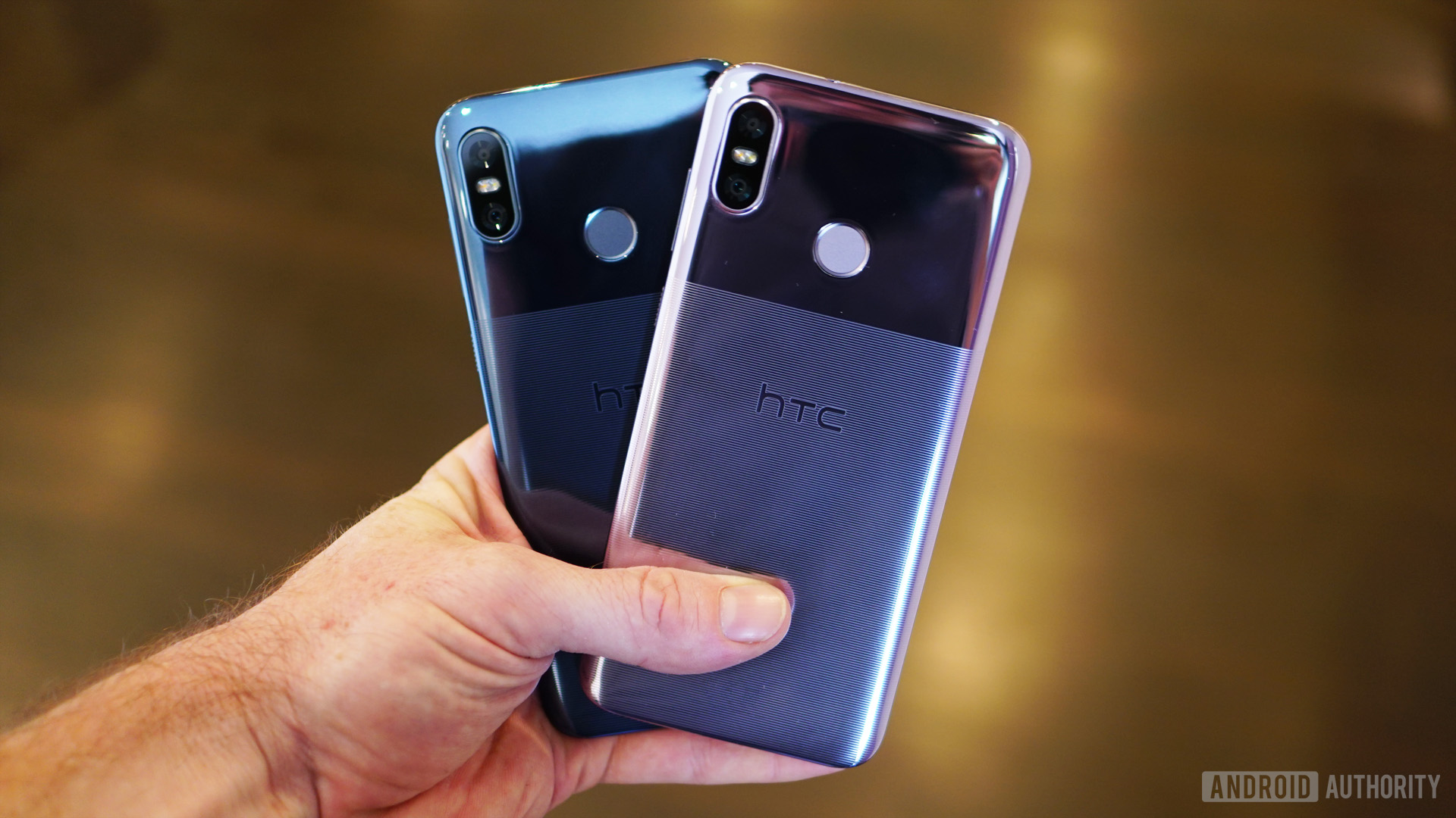 HTC U12 Life Moonlight Blue and Twilight Purple colors in hand