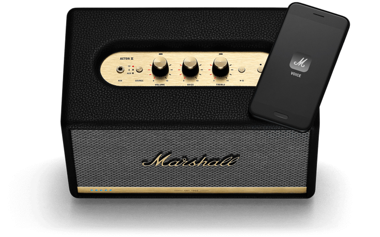 Marshall Action II Voice speaker wtih smartphone resting on top of it. Product image, top-down.