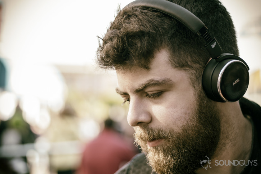 A photo of a man wearing the AKG N60 NC headphones.
