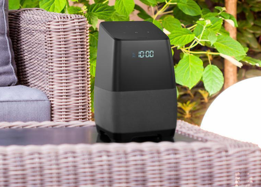 An image of a smart speaker on an outdoor patio set, as part of a smart speaker deal during August of 2018.