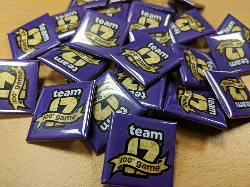 A pile of badges promoting the Team 17 game studio.