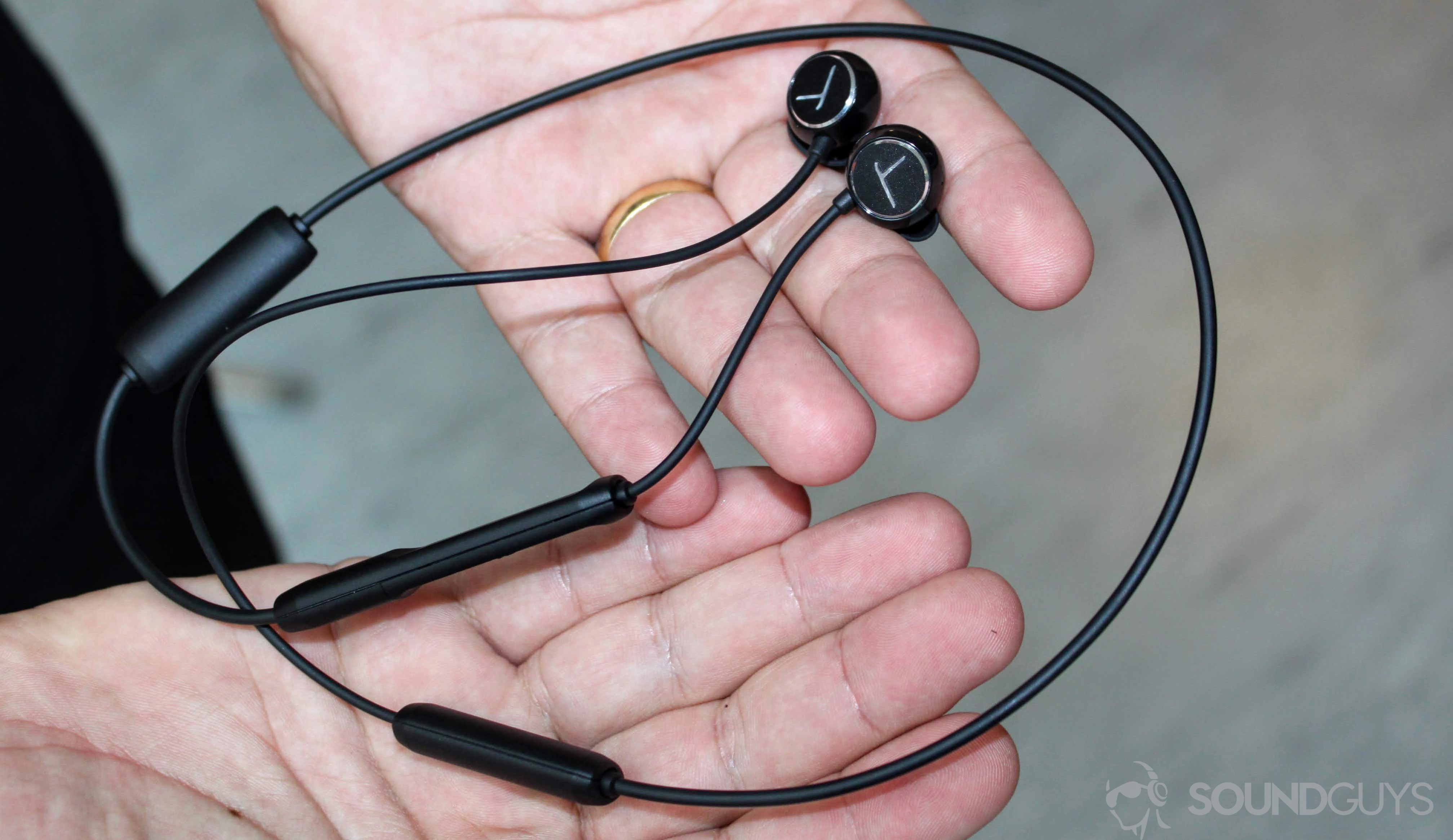 beyerdynamic headphones in a person's hand.