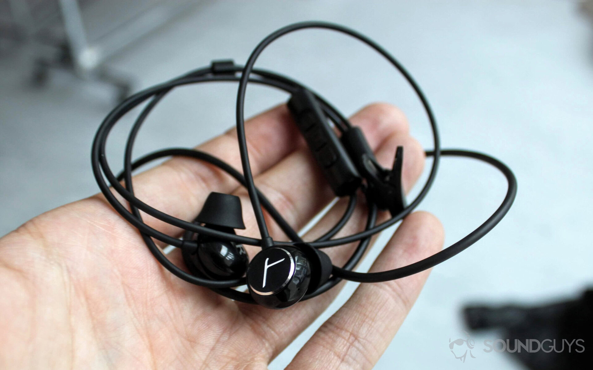 beyerdynamic headphones in a person's hand.