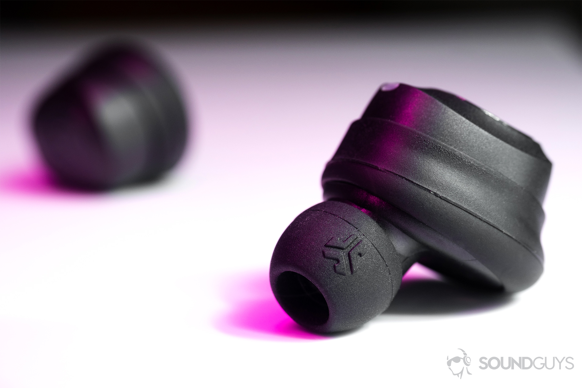 JLab  JBuds Air true wireless: A close-up of the earbuds showing the JLab  logo on the ear tips.