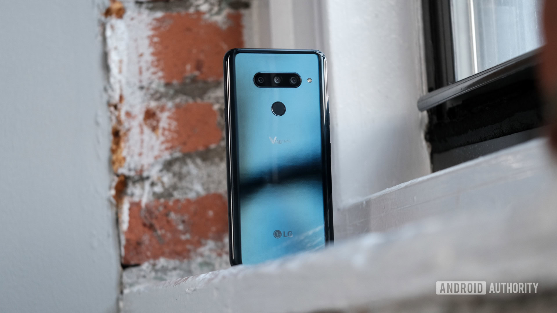 LG V40 ThinQ sitting on a window sill, LG V40 review