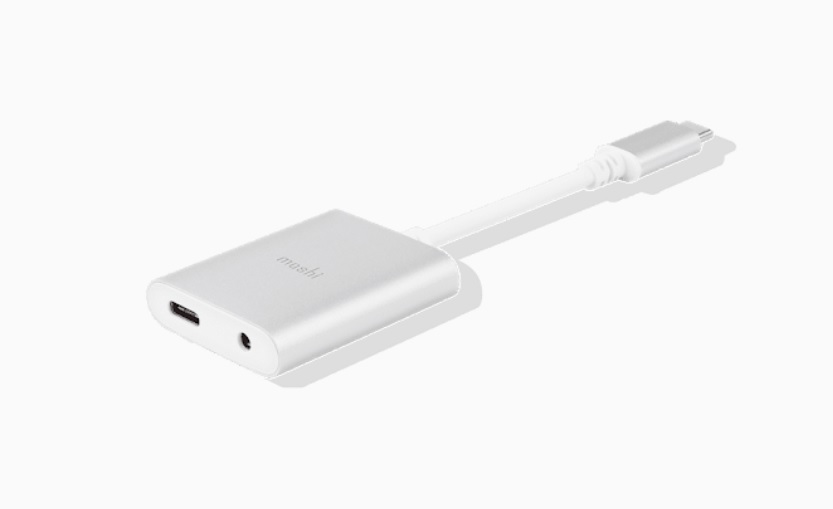 A promotional image of the Moshi USB-C Digital Audio Adapter with Charging.