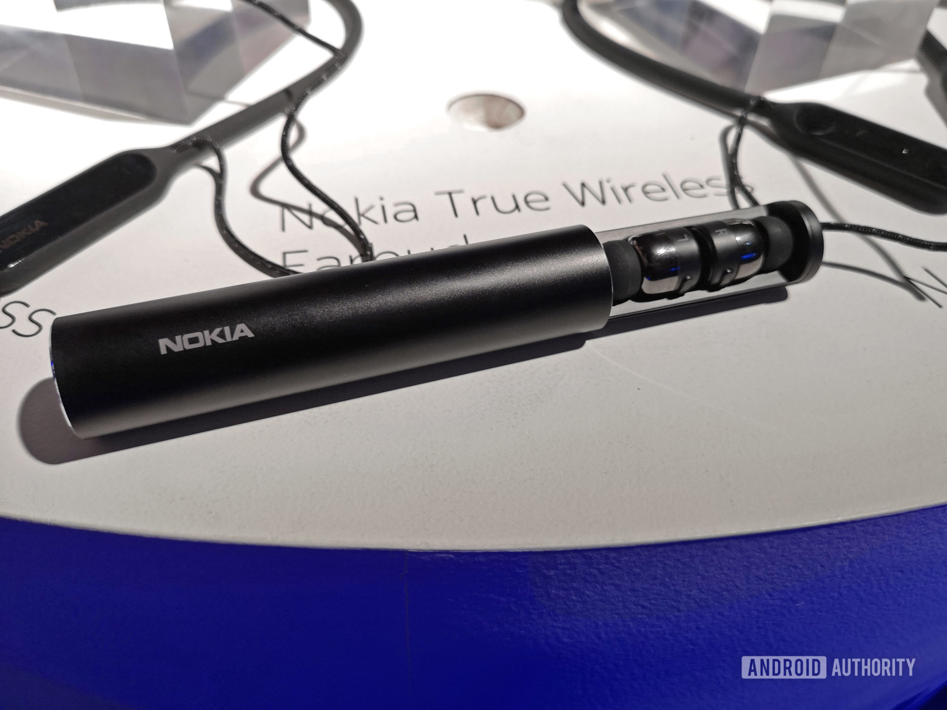 Nokia True Wireless V1 earphones on display at launch event.