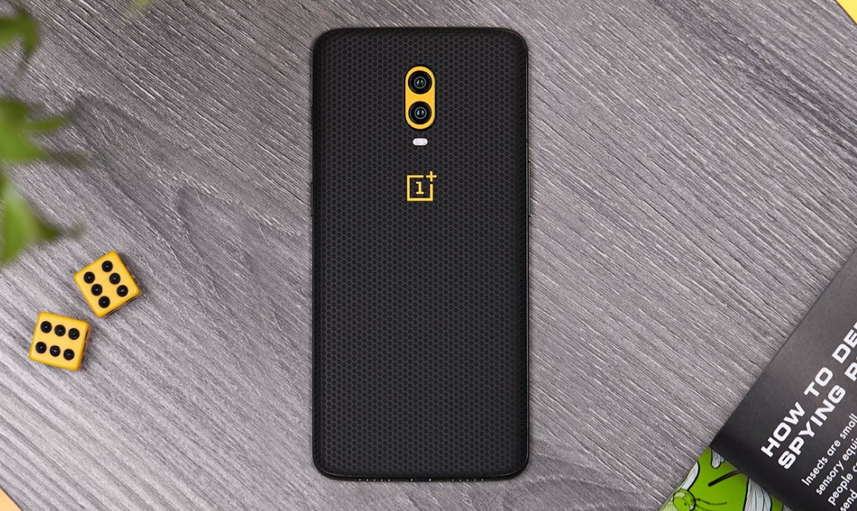 A promotional image of the OnePlus 6T covered with a dbrand skin.