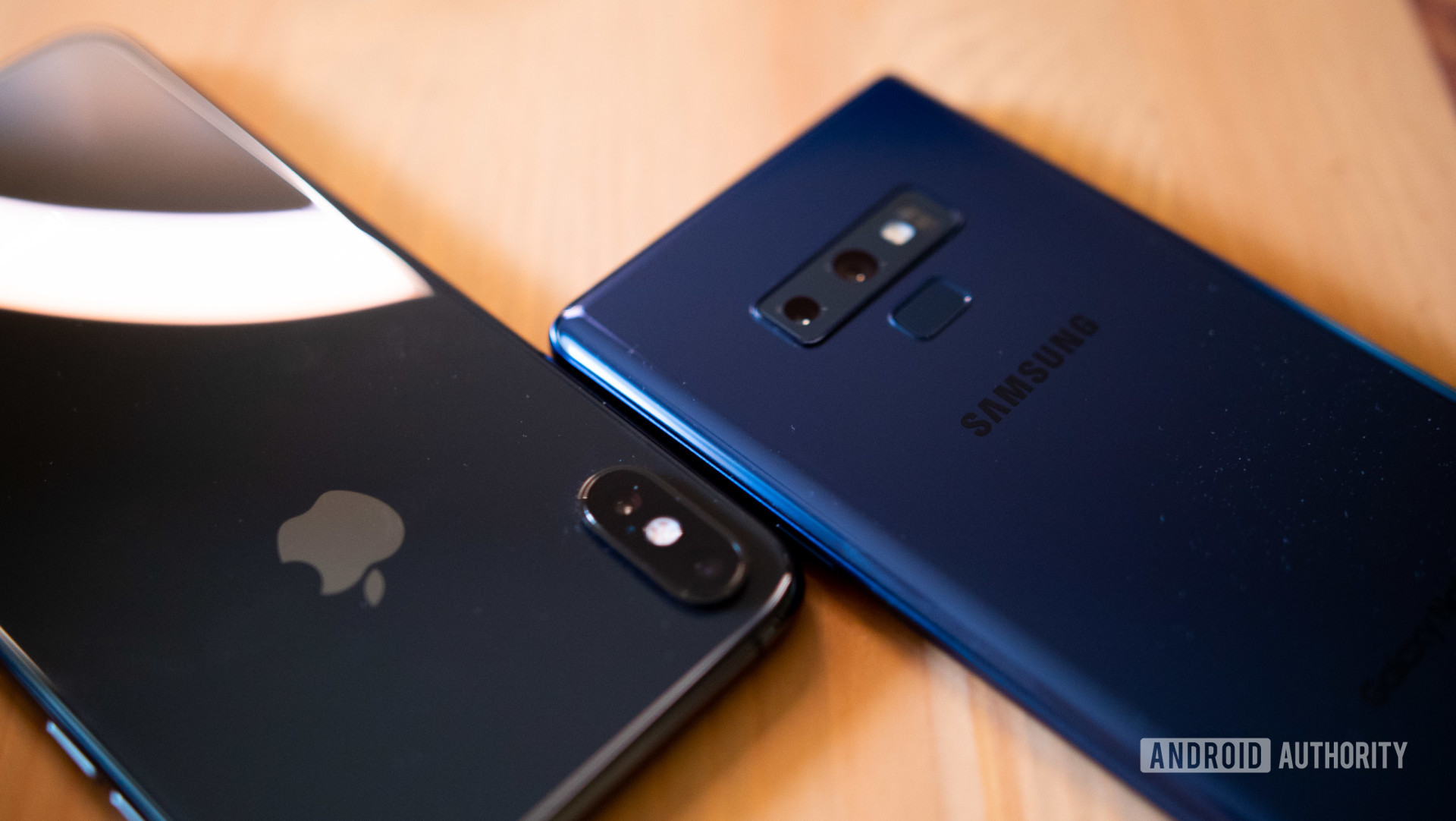Apple vs Samsung: the Galaxy Note 9 and the iPhone XS Max face down on a table.
