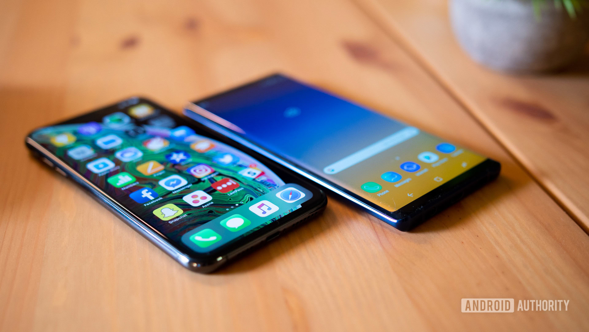 Apple vs Samsung: the Galaxy Note 9 and the iPhone XS Max face-up on a table. 