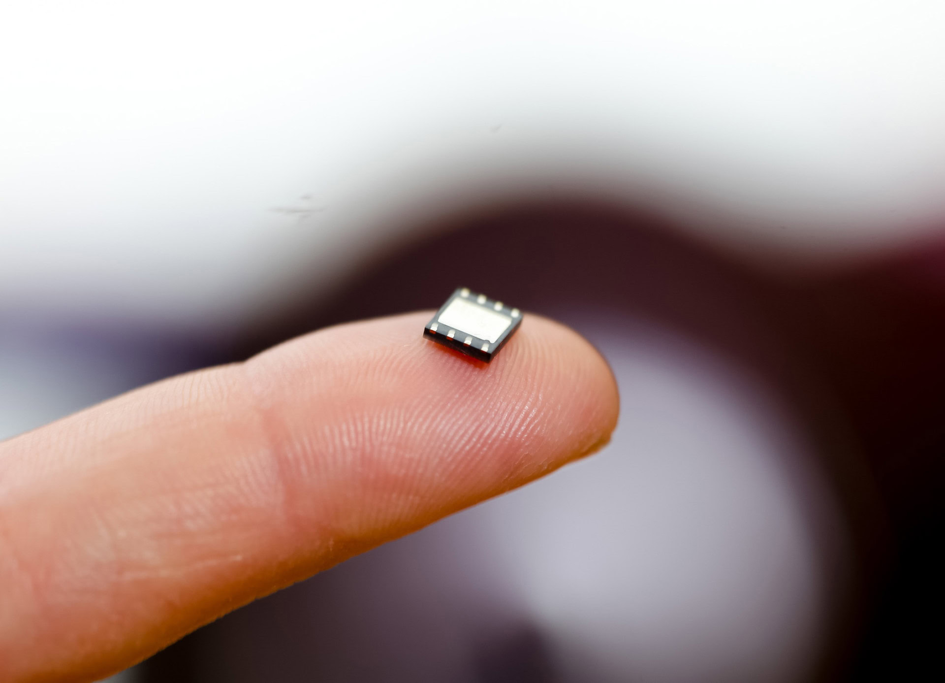 eSIM chip on a finger