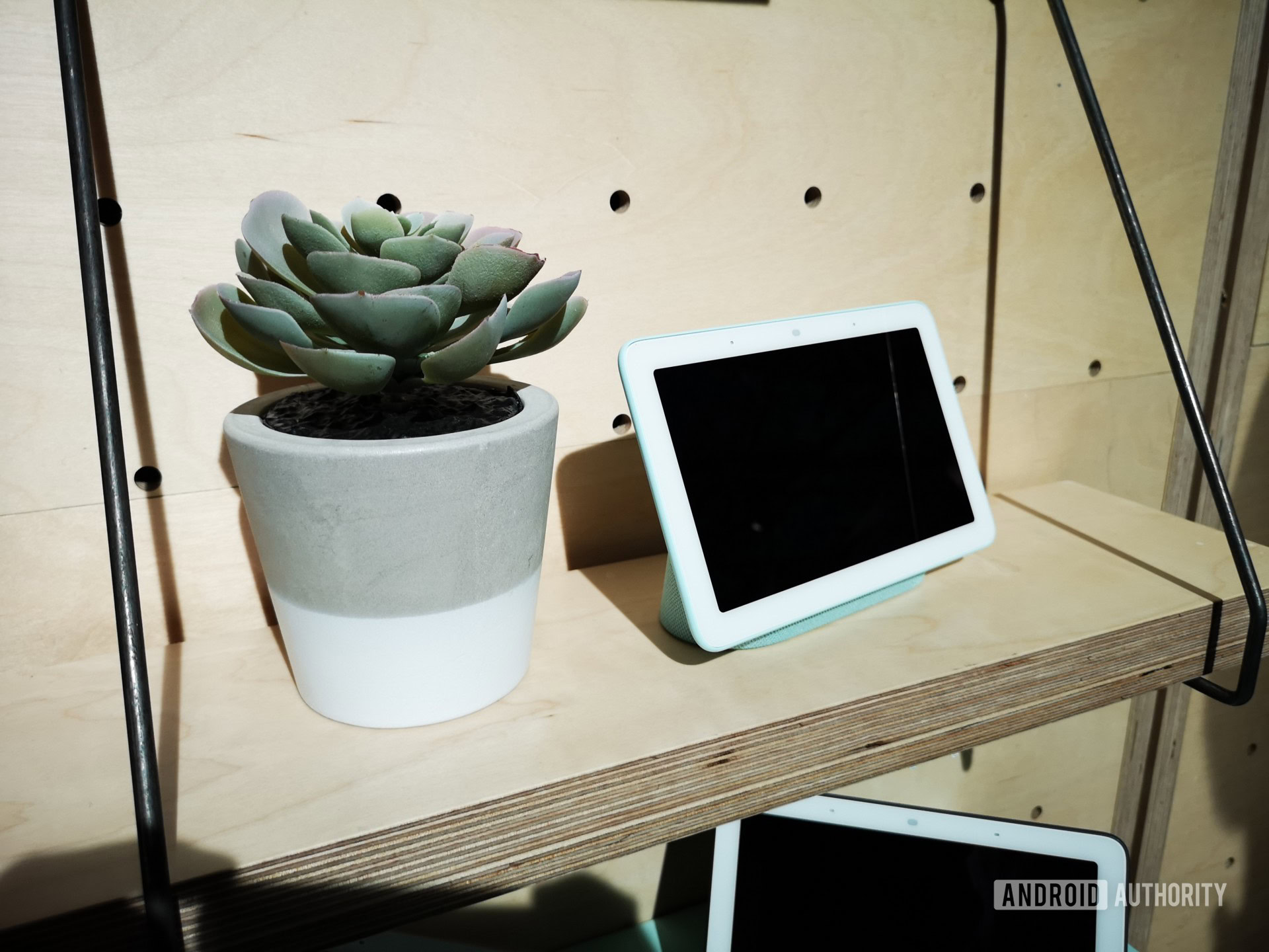 Google Home Hub on a shelf