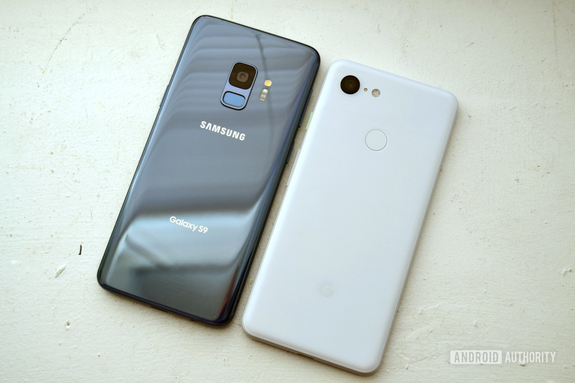 Photo of the backside of a google pixel 3  next to a samsung galaxy s9 comparing cameras design