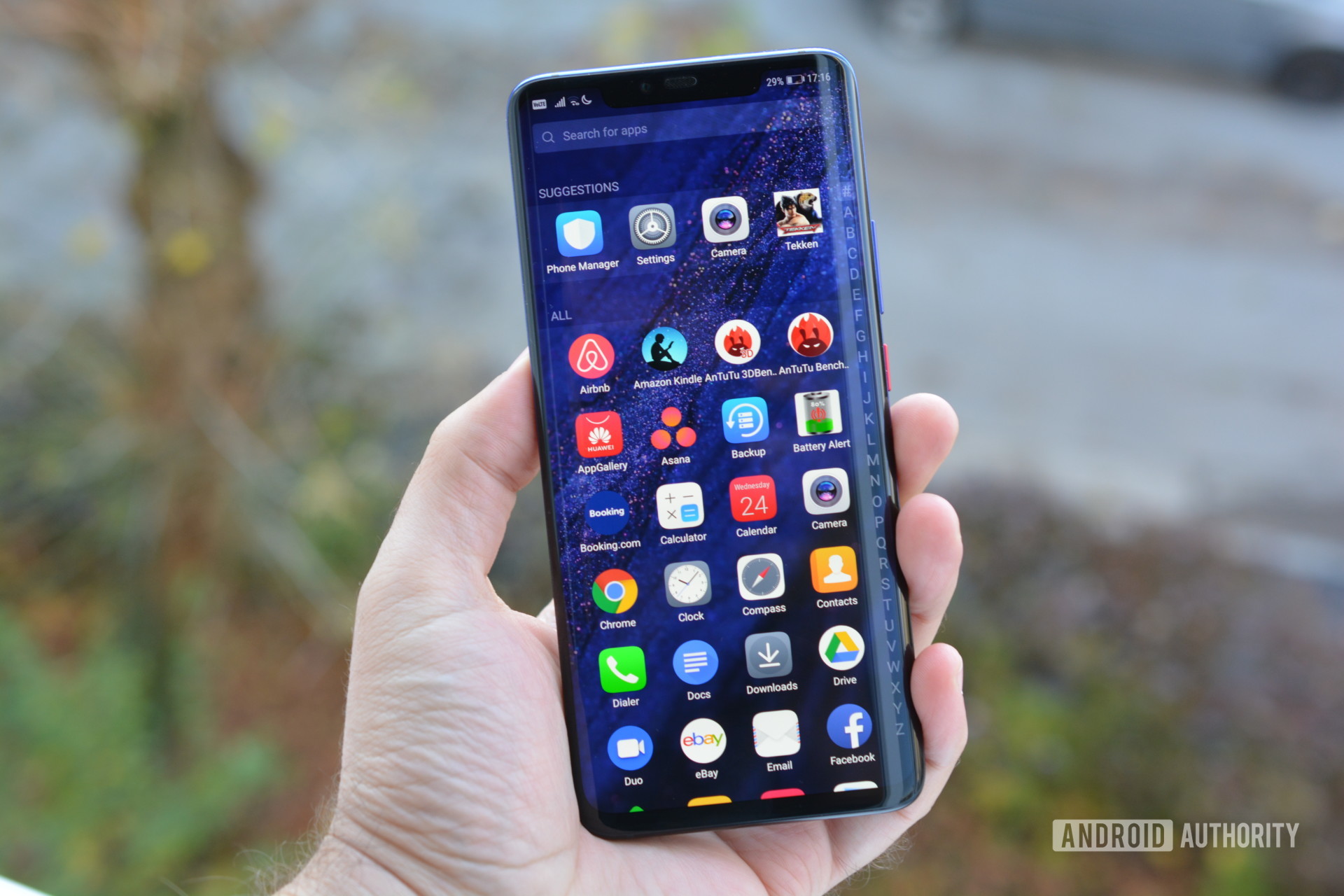 HUAWEI Mate 20 Pro handset showing the app drawer in a person's hand.