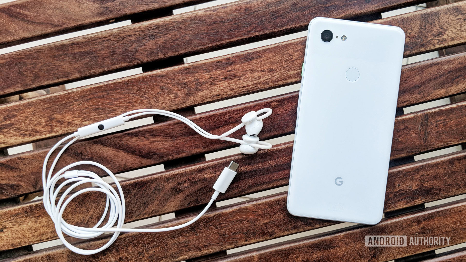 USB-C audio: Google Pixel USB-C earbuds in white next to Google Pixel 3.