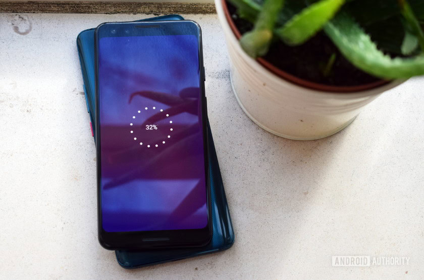 Picture of a HUAWEI Mate 20 Pro wirelessly charging up the Google Pixel 3