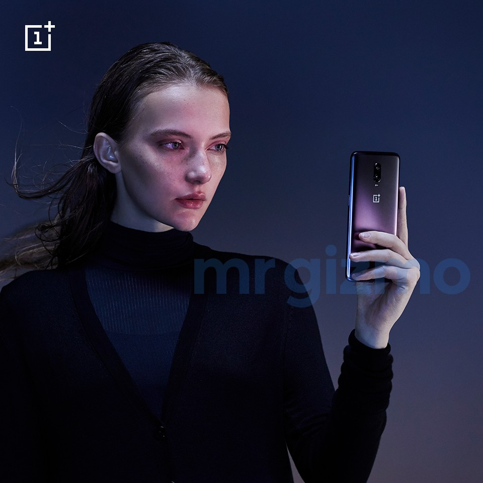 The OnePlus 6T in Thunder Purple in a person's hand.