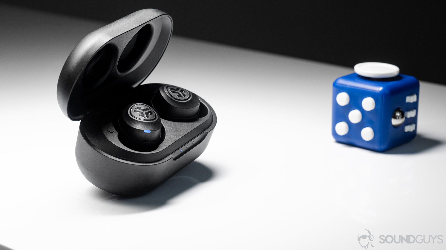 JLab  JBuds Air true wireless: The earbuds in the case which is open and angled away (slightly) from the lens.