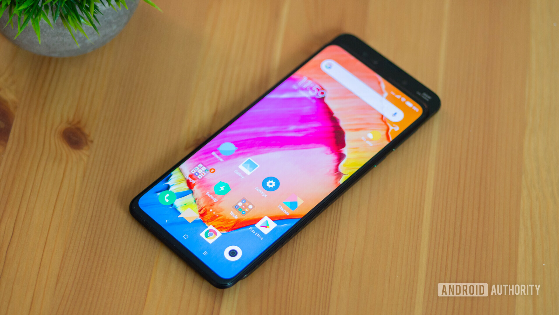 Front side of the Xiamoi Mi Mix 3 with the display turned on showing the default MIUI launcher.