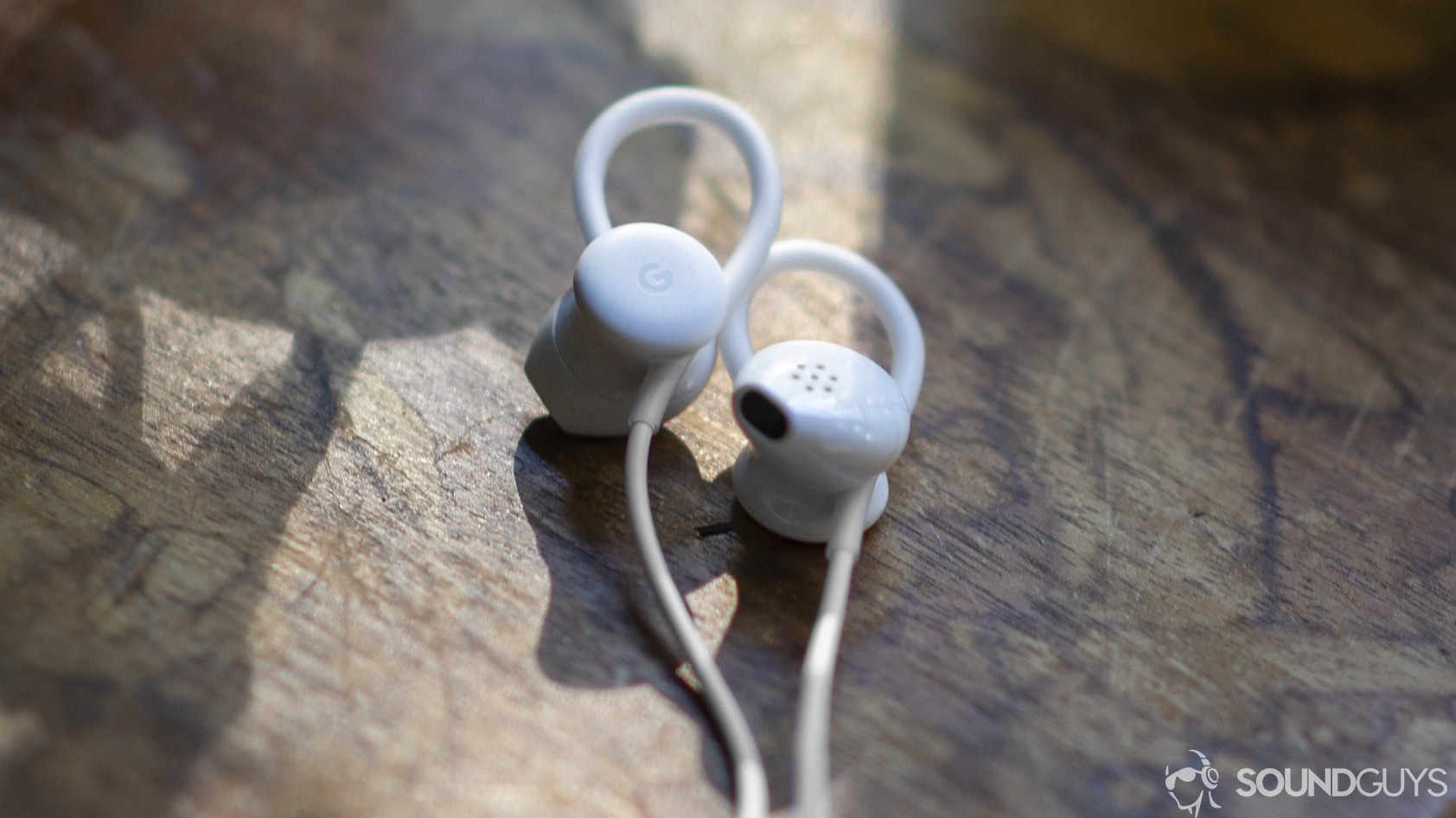 Google Pixel USB-C Headphones on a stone surface.