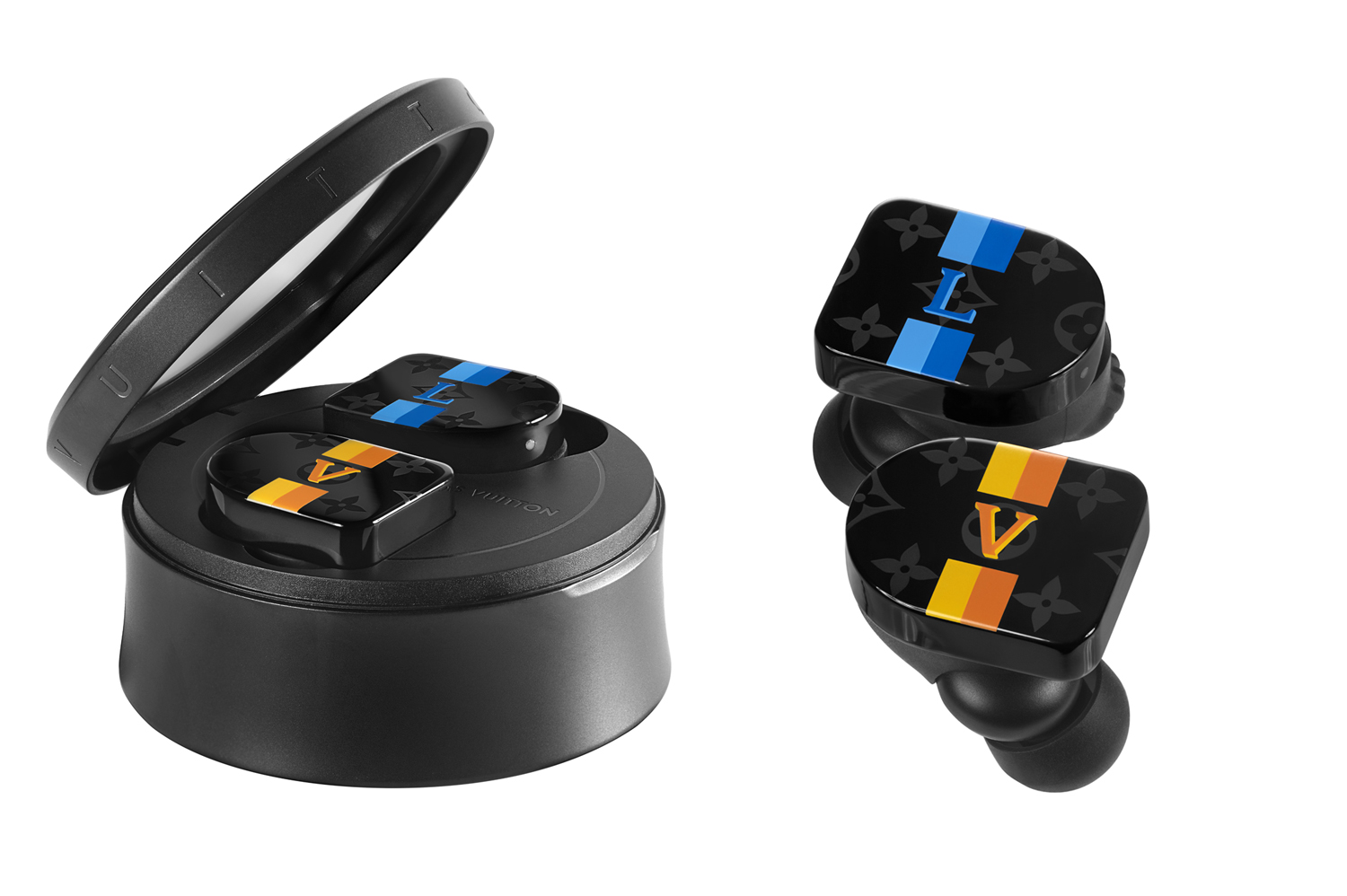 Master & Dynamic Louis Vuitton Horizon: Earbuds in blue and orange stripes on black background. The left side of the image shows the earbuds in the cylindrical, black charging case.